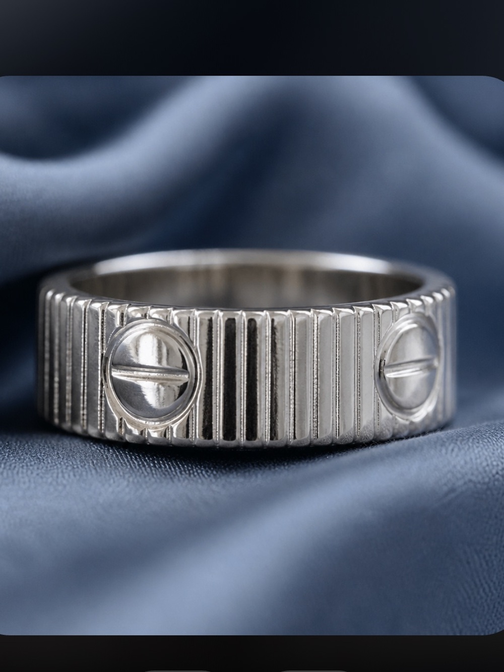 Source Unknown Silver Ribbed Ring with Screw Motifs